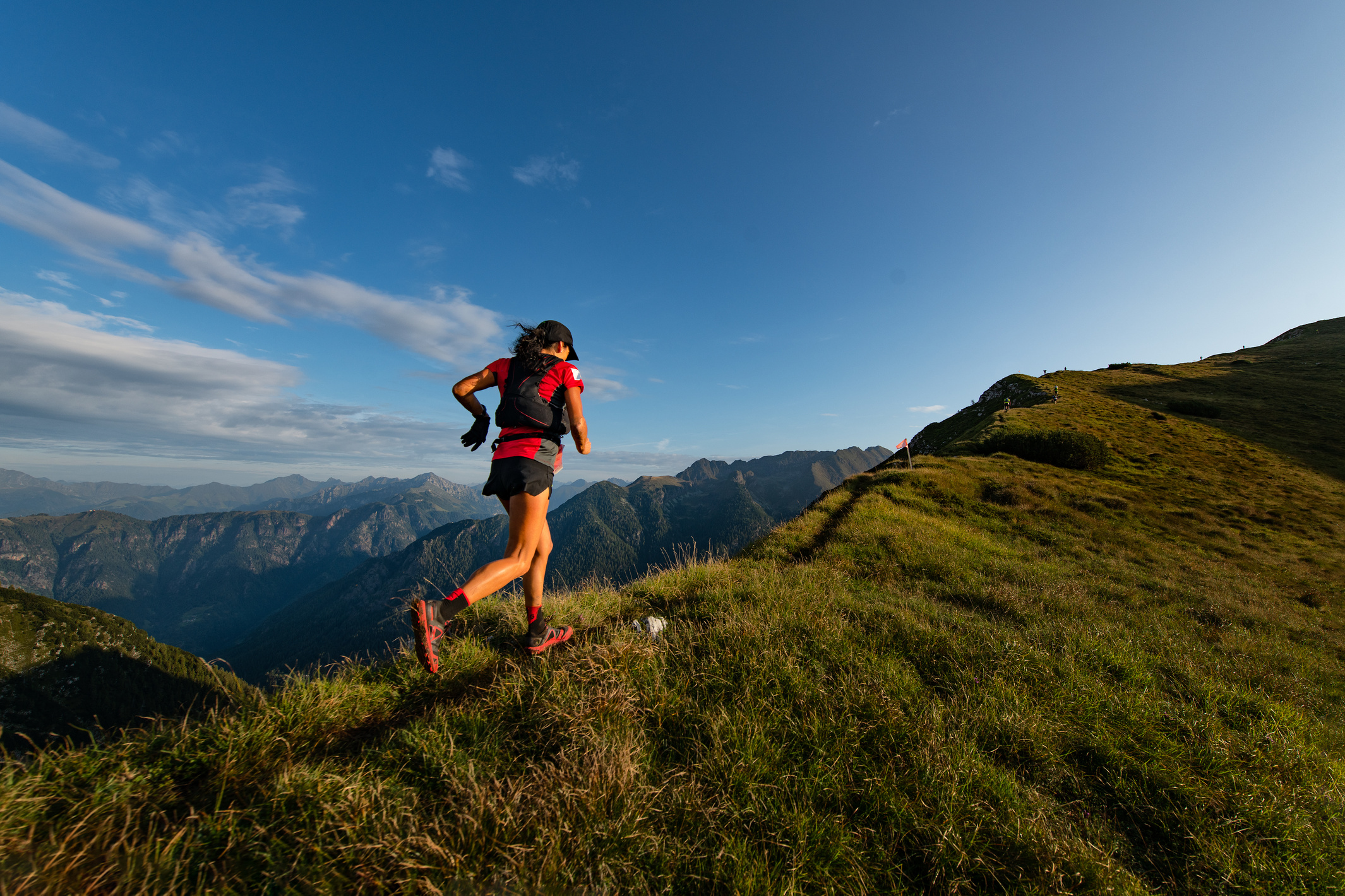 Person Running on a Mountain Ridge 